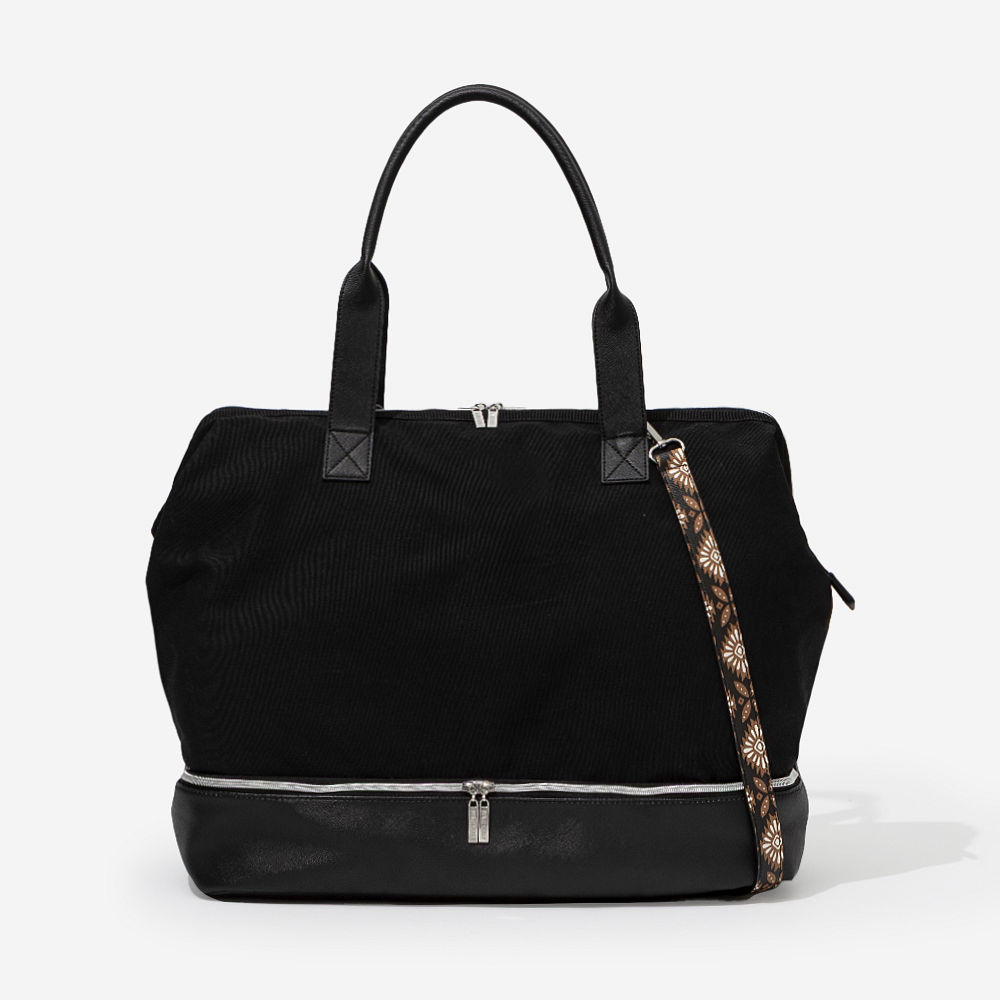 ivory canvas weekender with shoes in bottom compartment