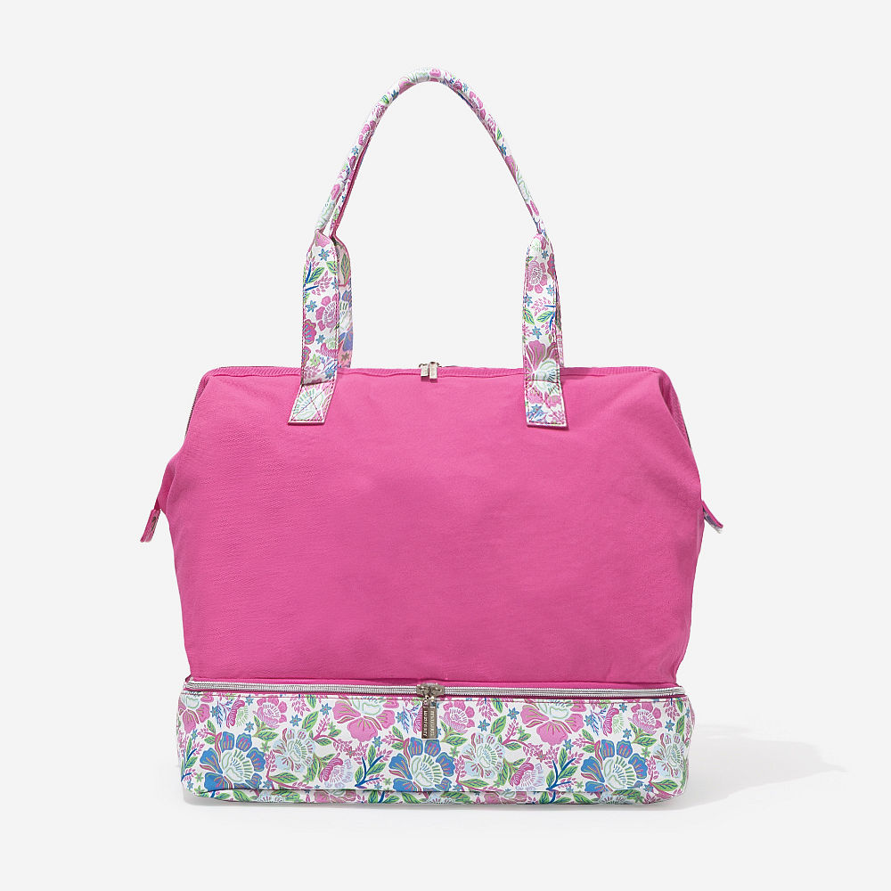 ivory canvas weekender with shoes in bottom compartment