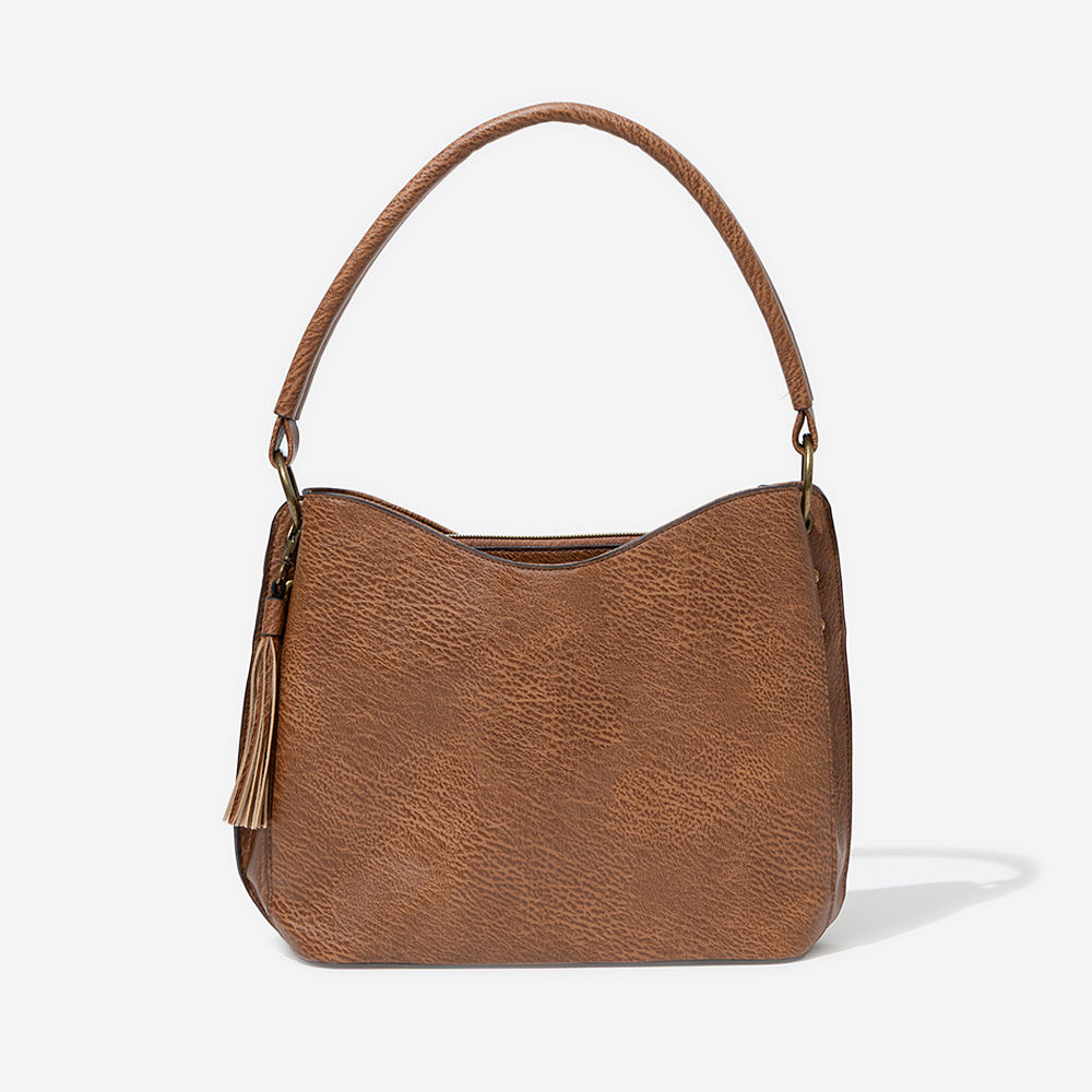 camel brown cheyenne purse on shoulder