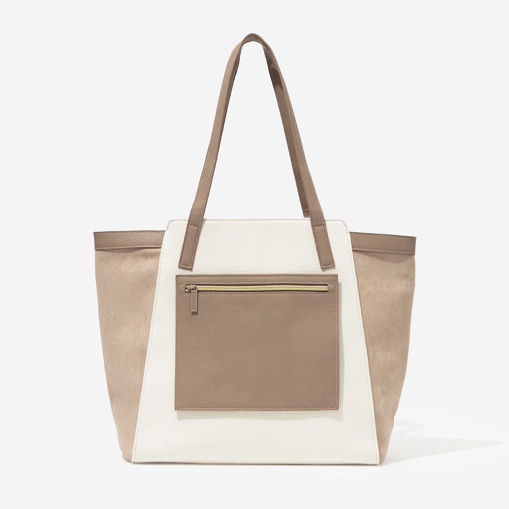 taupe colorblock tote bag on arm with split initials