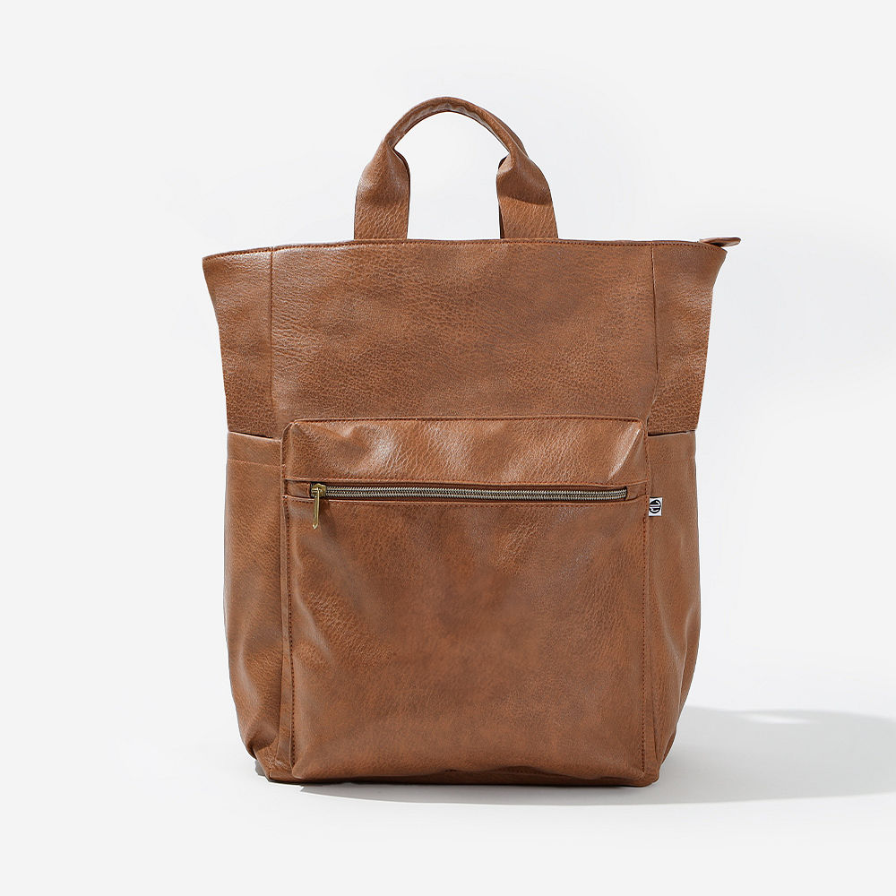Brown commuter backpack swinging in studio