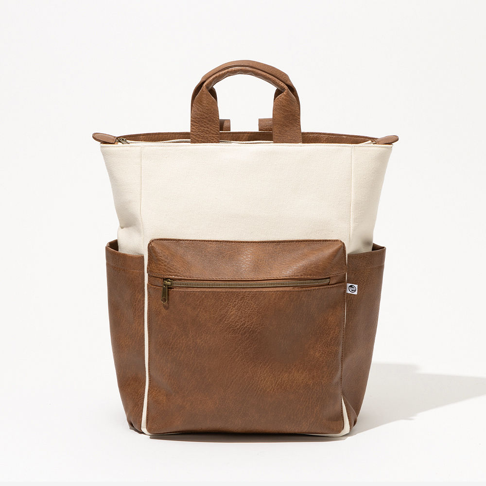 Brown commuter backpack swinging in studio
