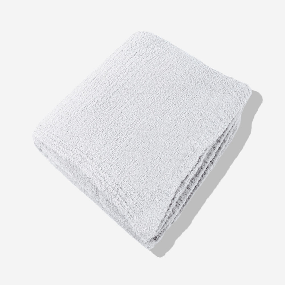 neutral leopard personalized cozy blanket on bed