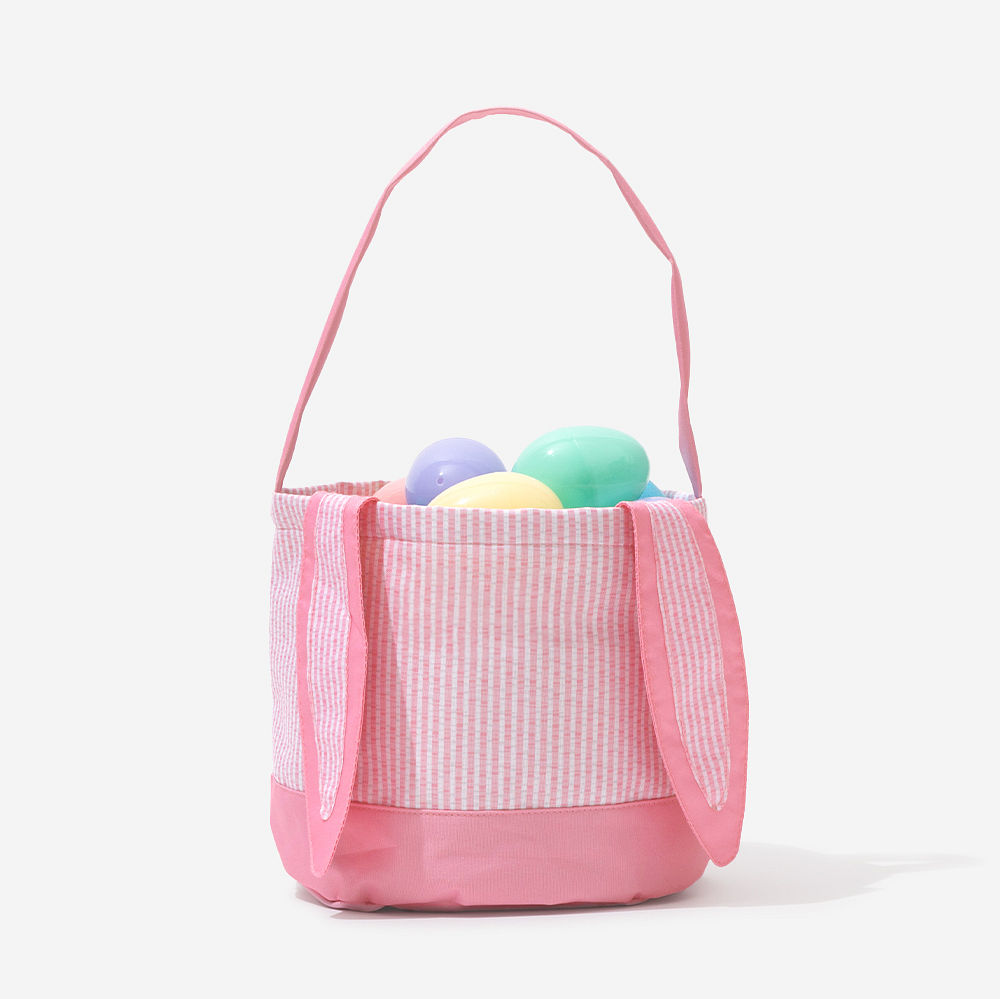 pink seersucker easter basket with easter eggs