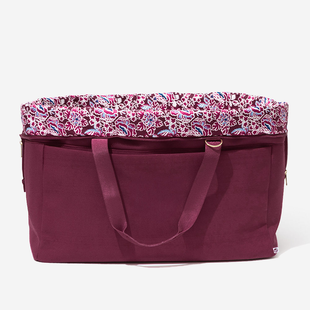 burgundy woodland blossom foldover weekend bag on arm