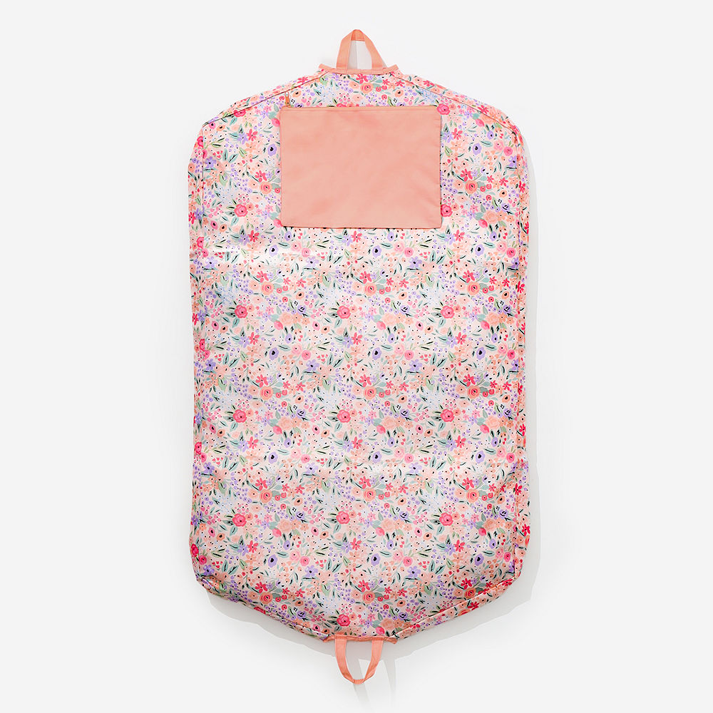 coral floral garment bag flatlay