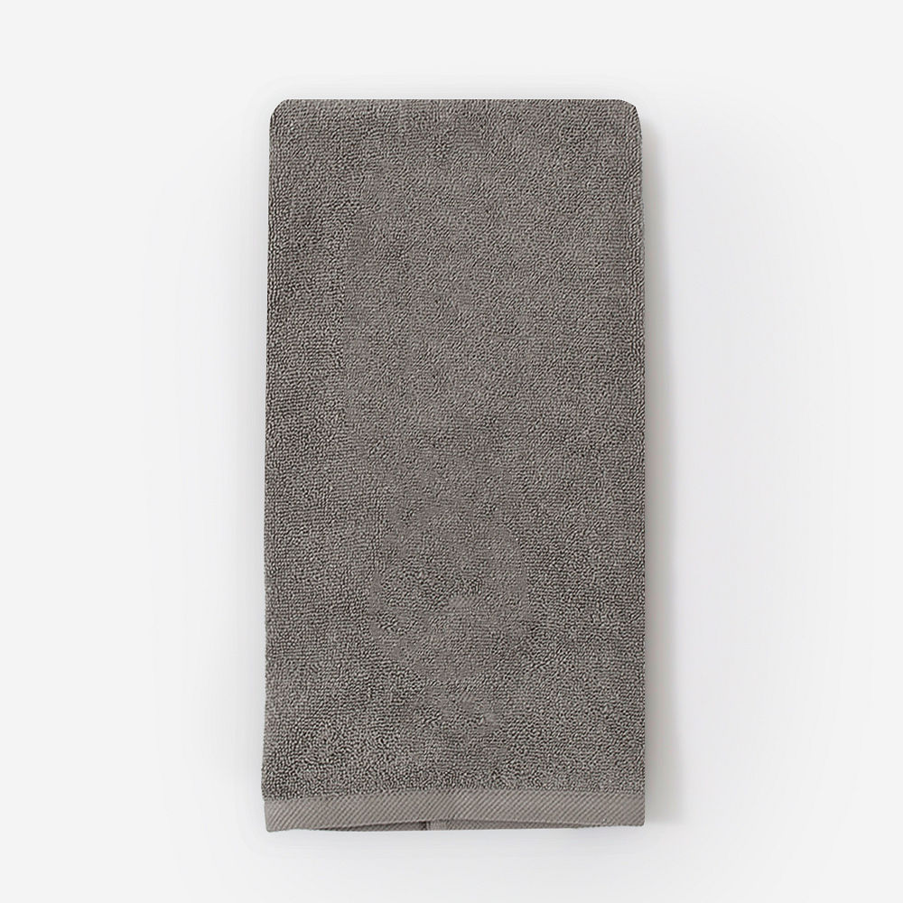 grey hand towel on towel holder