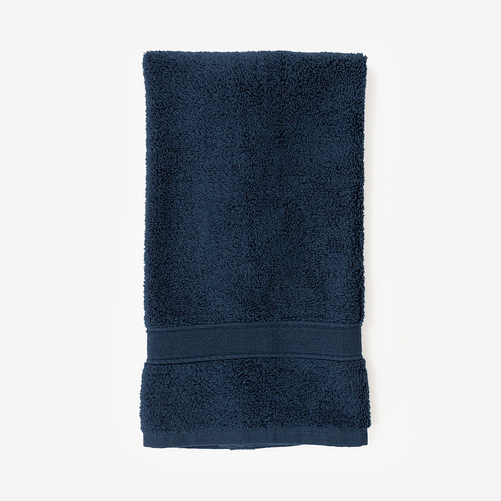 grey hand towel on towel holder