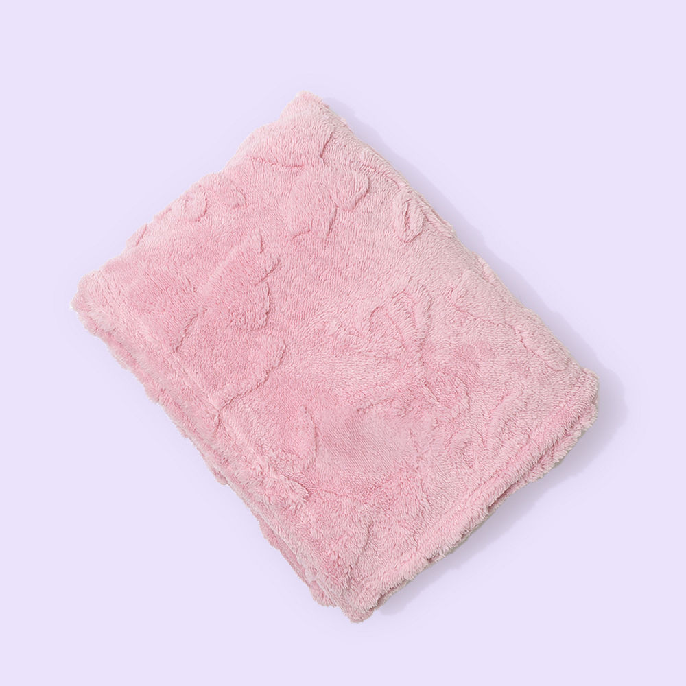 pink kids bow blanket on bed