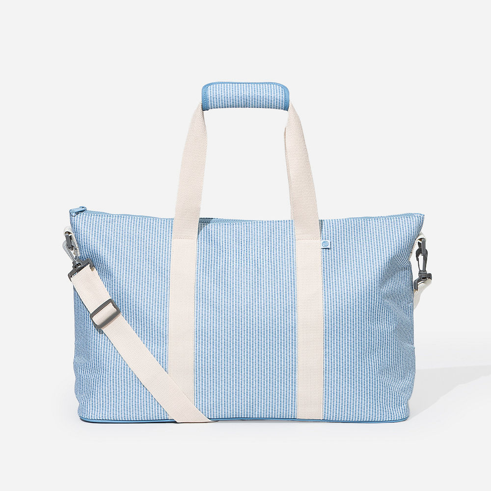 close up of navy boys embroidered weekend duffle bag
