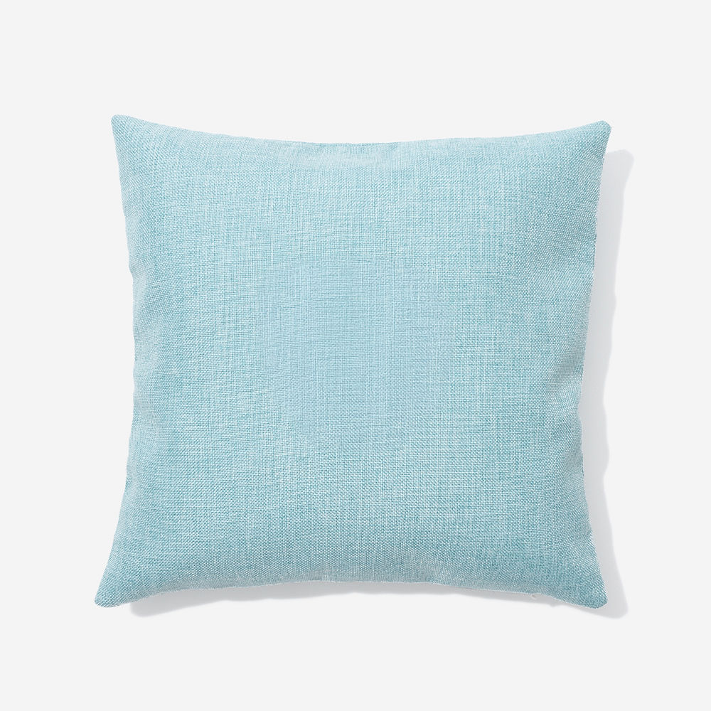 light blue linen pillow case on neutral chair