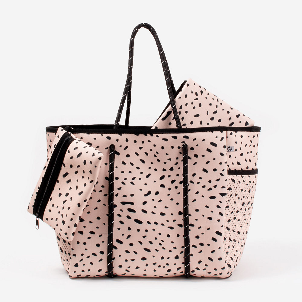 monogrammed neoprene diaper bag in blush safari on grass