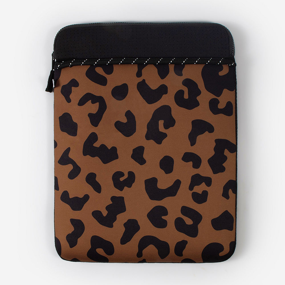 girl holding tan monogrammed neoprene laptop case