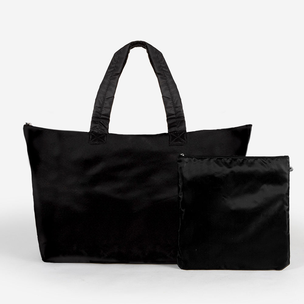 black packable duffel bag in car