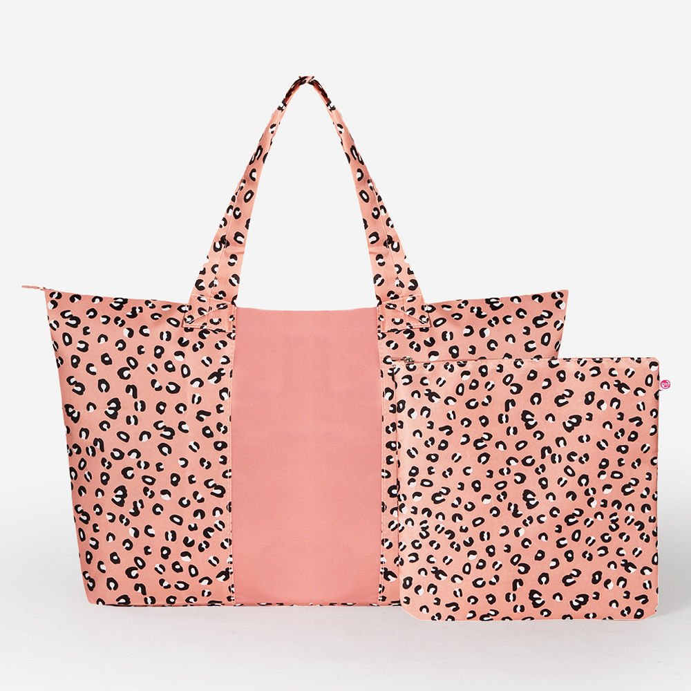 packable duffel bag in cheetah ready to travel