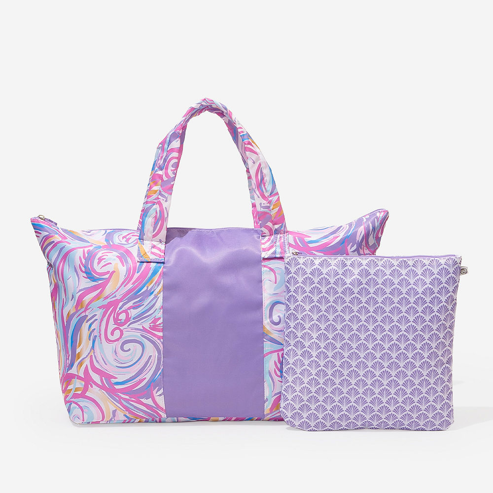 black packable duffel bag in car