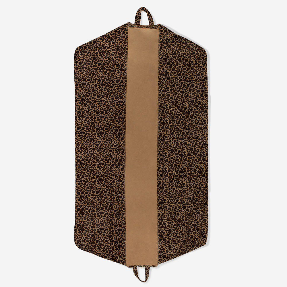 black packable garment bag and duffel in trunk