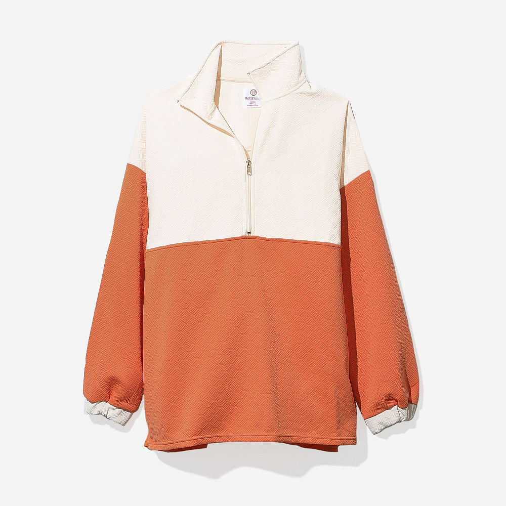 tan pullover tunic close up of quilted texture