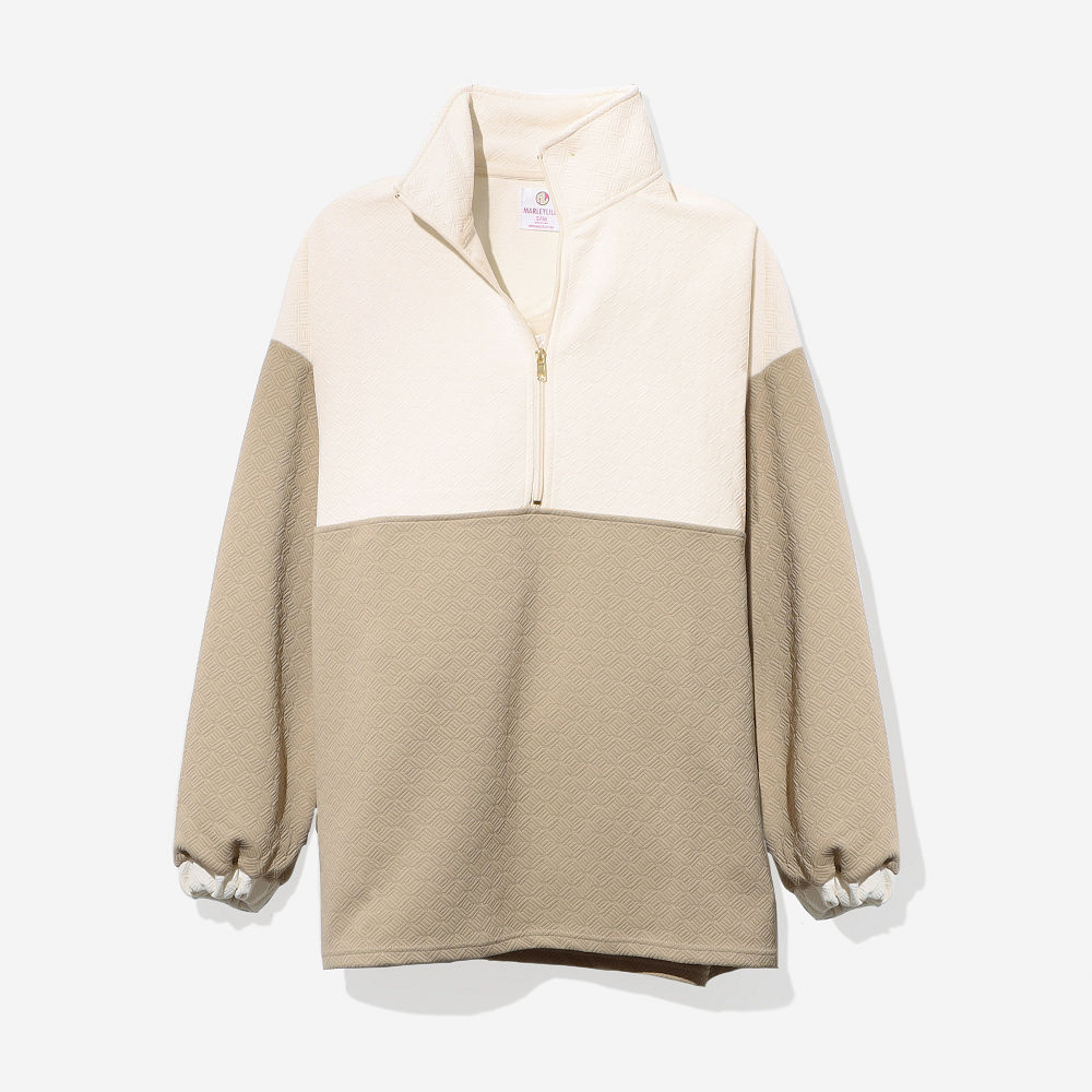 tan pullover tunic close up of quilted texture