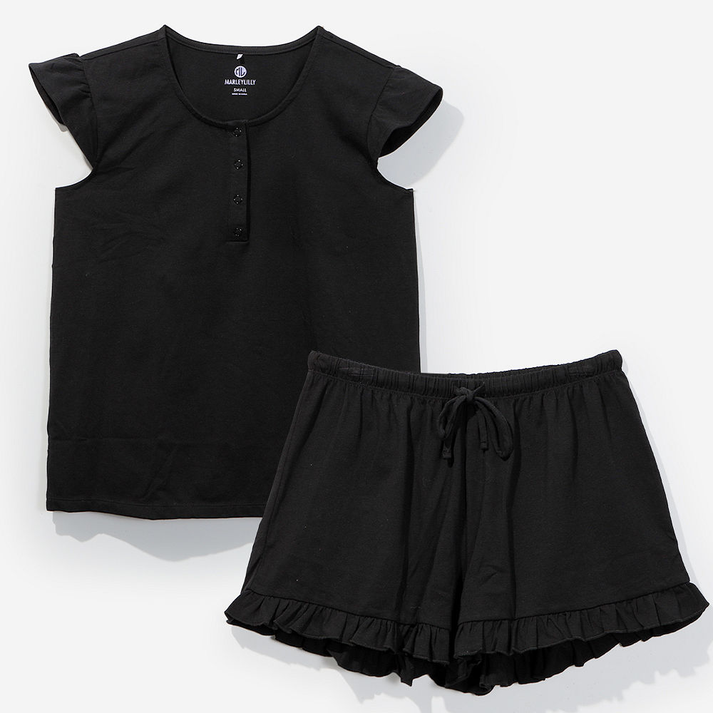 close up of black ruffle monogrammed sleep set