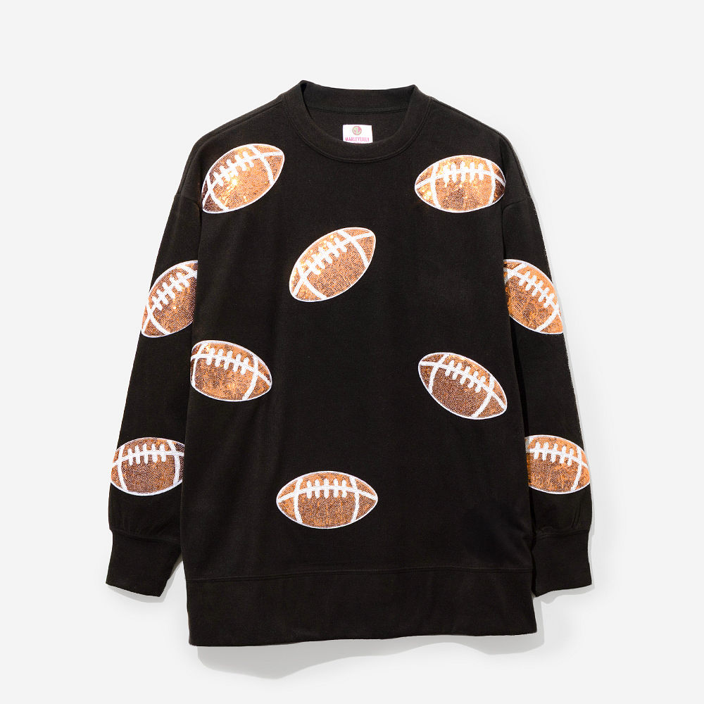 light pink sequin sports sweatshirt on peyton with baseball earrings