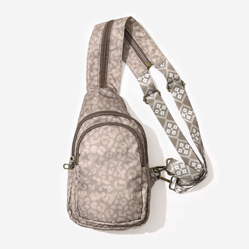 sling backpack in tonal taupe leopard up close