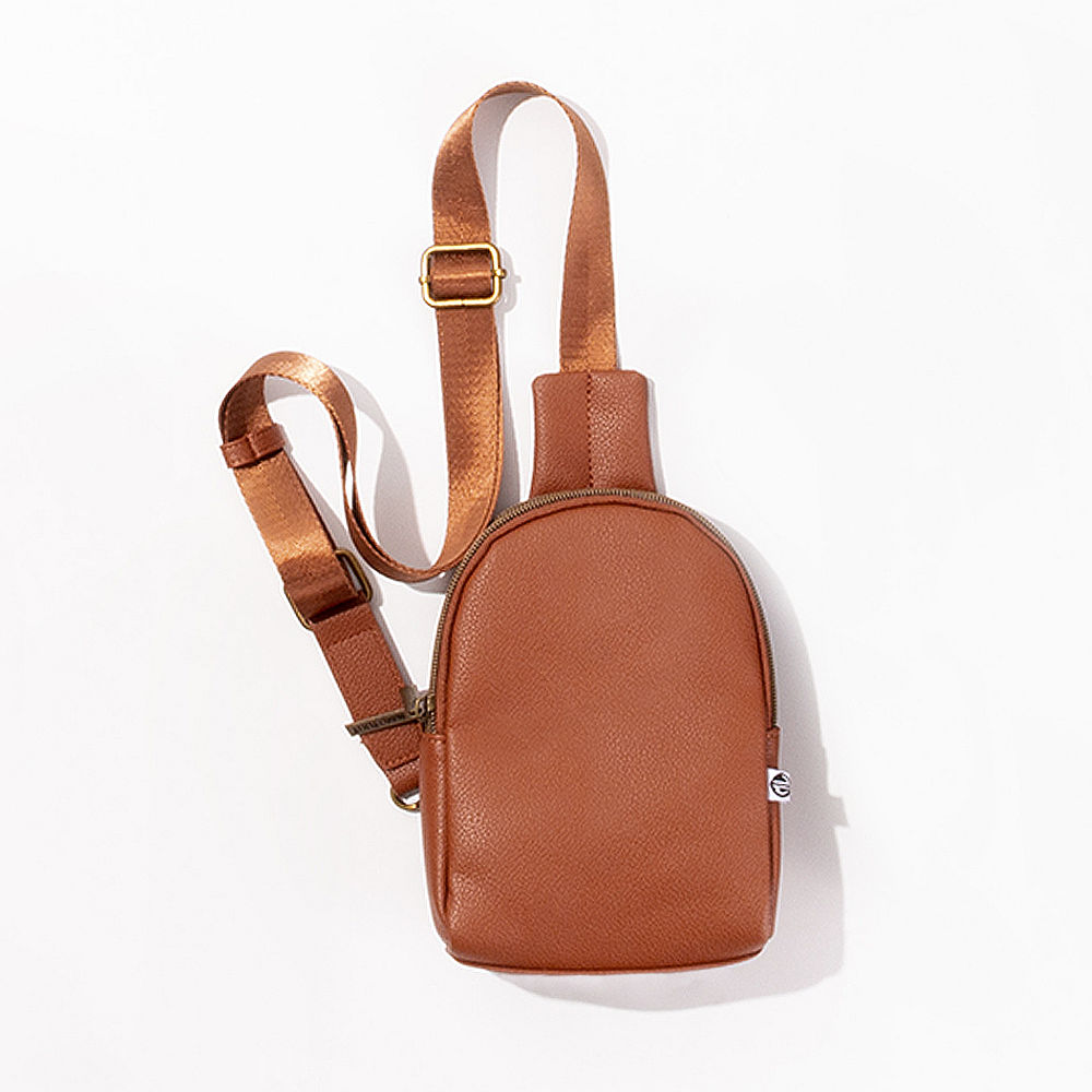 brown sling bag on plus size model
