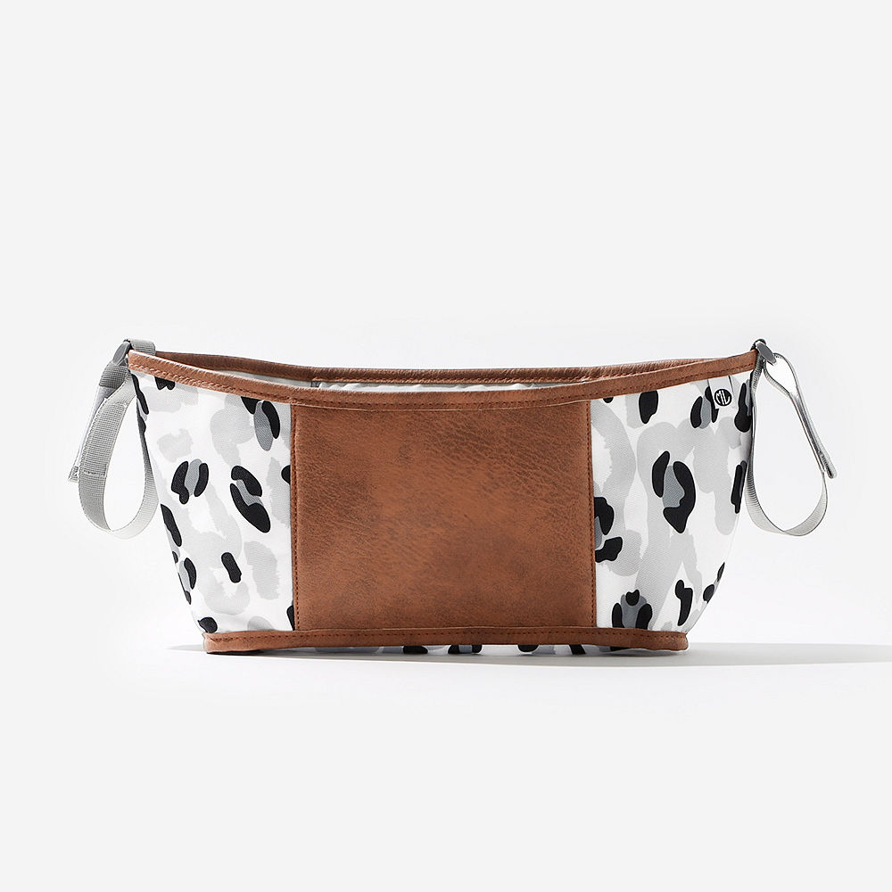 black sassy spots stroller caddy with stroller on grass