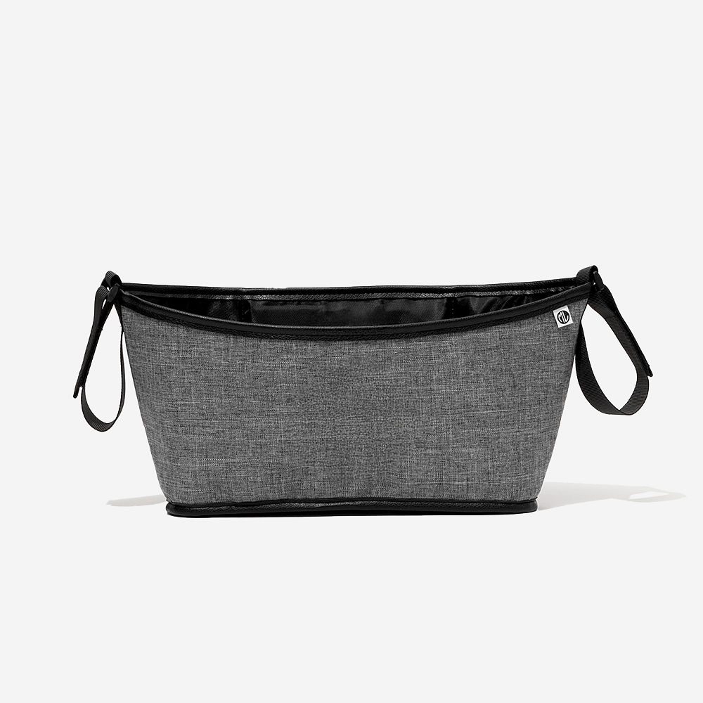 black sassy spots stroller caddy with stroller on grass