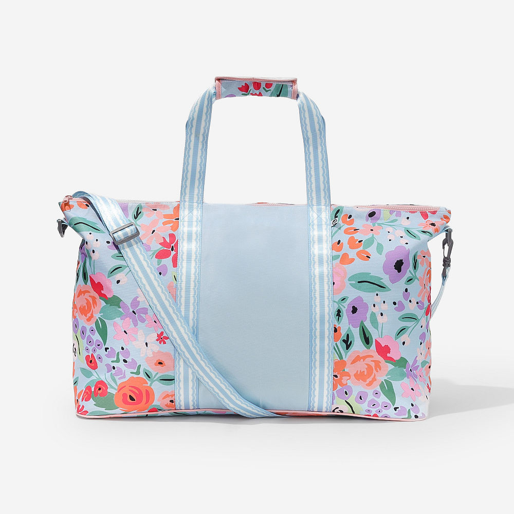monogrammed french floral travel bag sets over shoulder and in arms