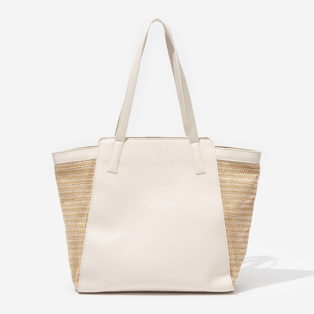 bone tropical travel tote on shoulder