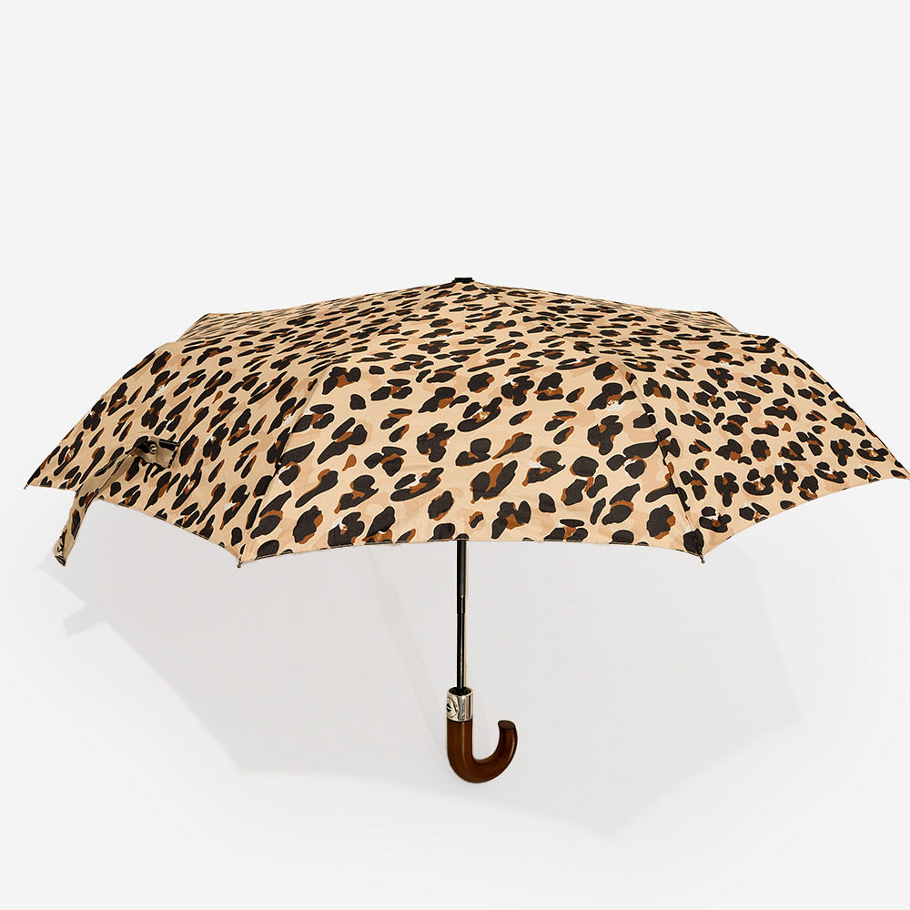 tan checker umbrella in hands