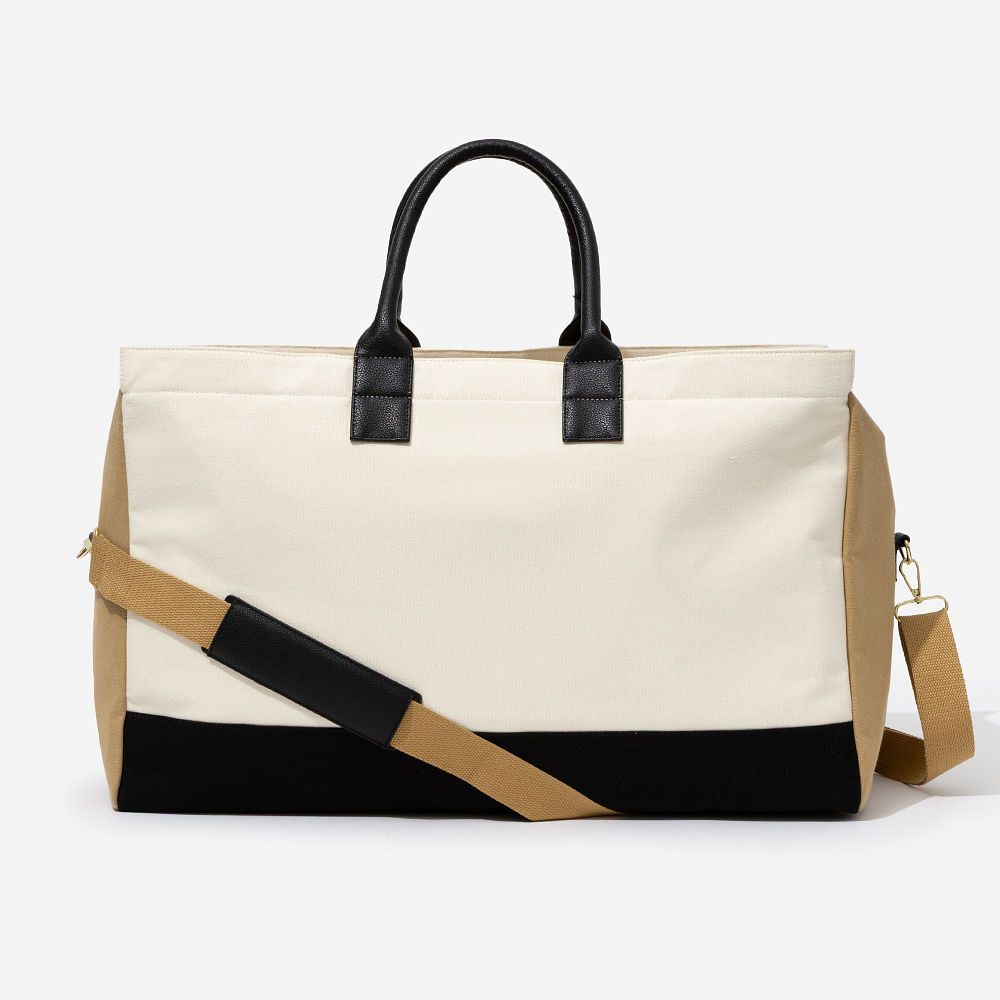 upscale monogrammed weekender in ivory on luggage