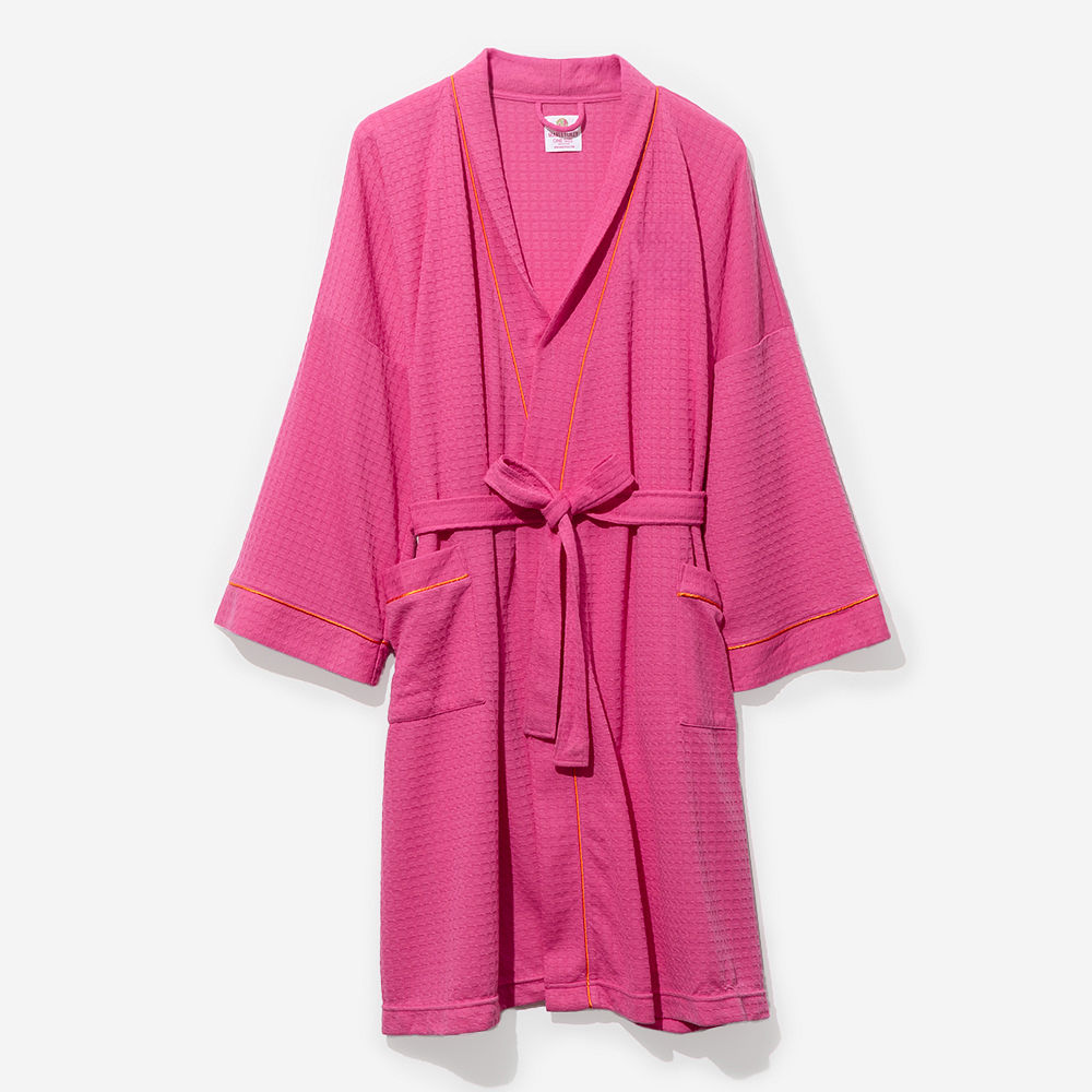 close up of hot pink monogrammed robe with dog