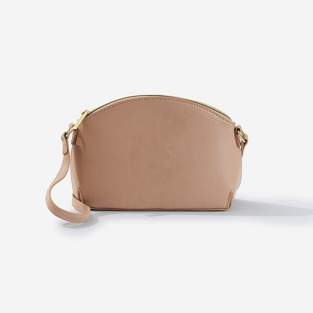 spill shot with tan youth crossbody purse