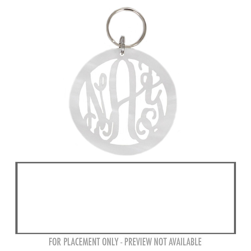 acrylic monogrammed keychain on the grass