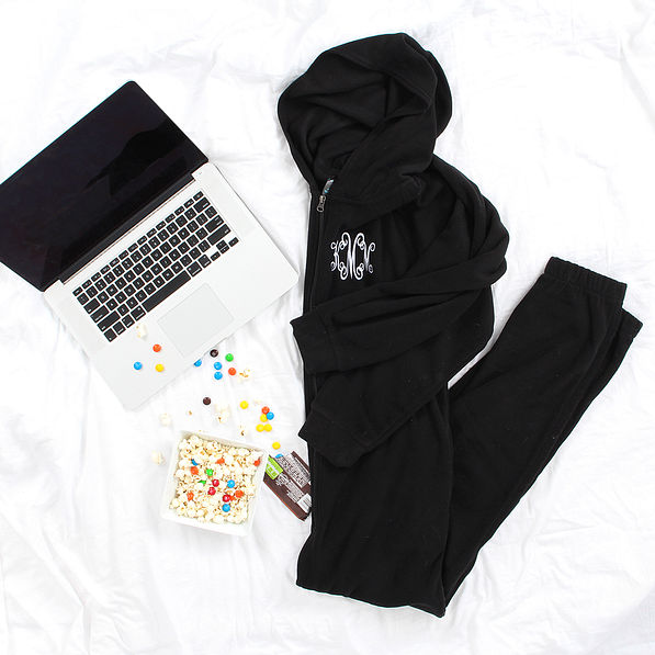 monogrammed pajama lounger with laptop and candy