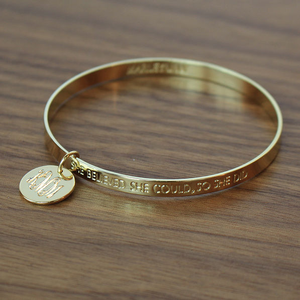 Gold Inspirational Bracelet on Wood Table