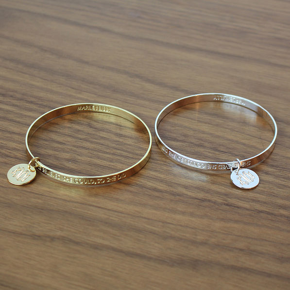 Silver and Gold Inspirational Bracelets on Wood