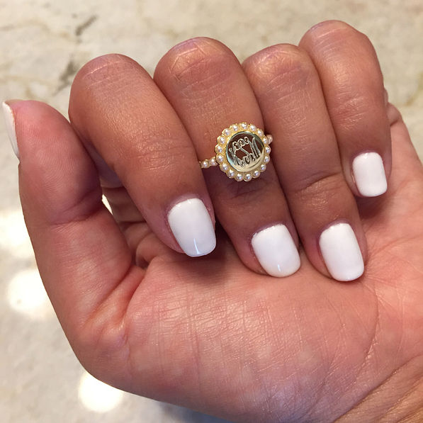 round gold ring with pearl details