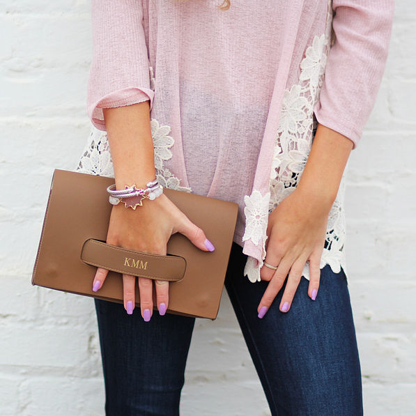 brown foil stamped clutch with pink sweater
