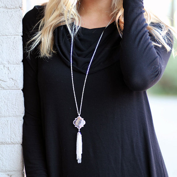 silver quatrefoil necklace tassel monogram black shirt