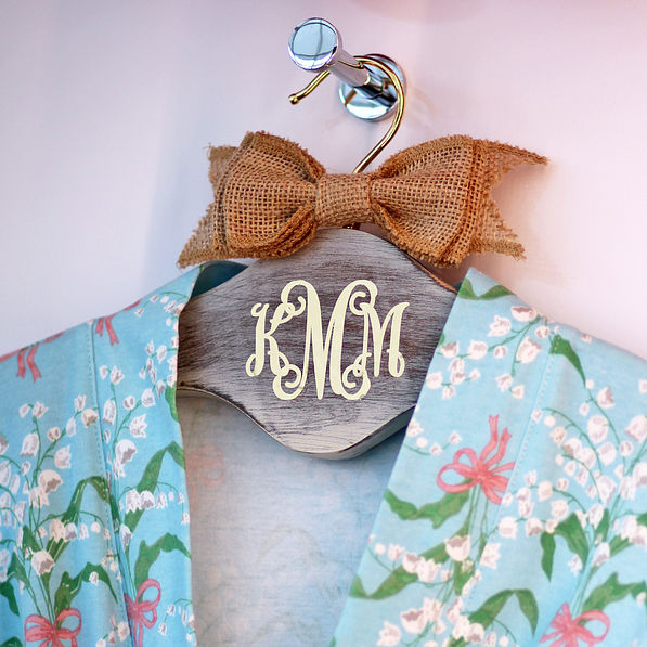 floral robe on monogrammed hanger with burlap bow