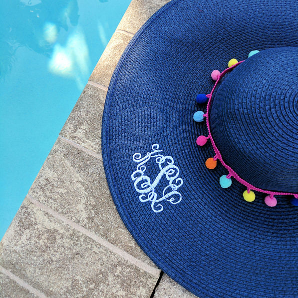 navy straw monogrammed floppy hat with multicolored poms