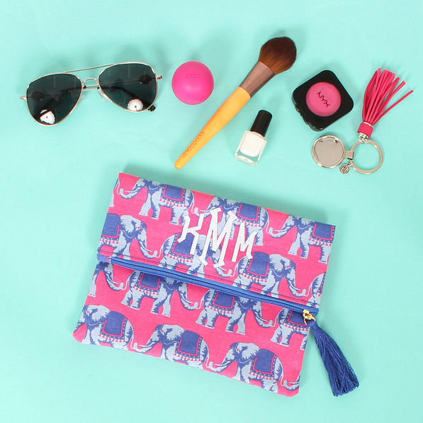 elephant pattern fold over clutch with tassel zipper