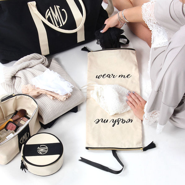 Girl packing her Monogrammed Lingerie Bag