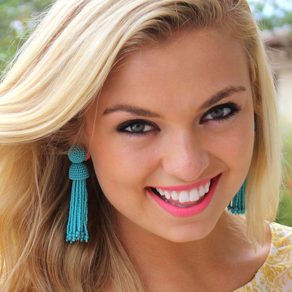 model wearing Turquoise beaded Tassel Earrings