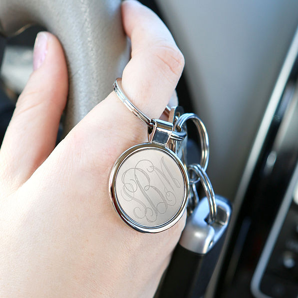 Driver with a Silver Monogrammed Round Key Chain