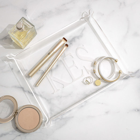 monogrammed acrylic tray on marble counter
