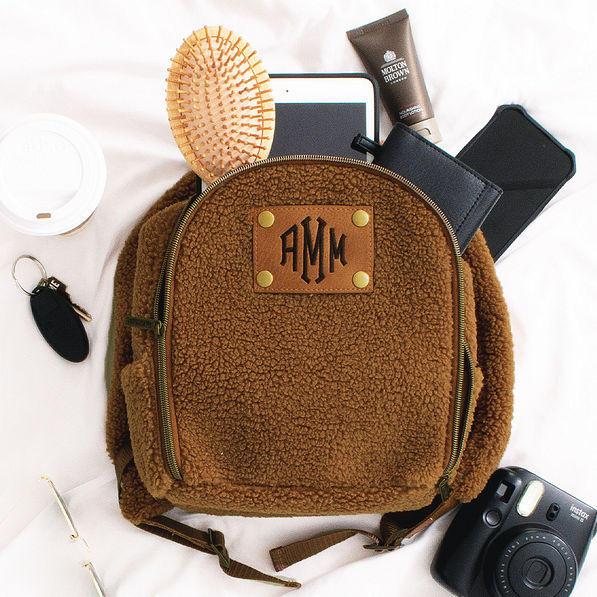 Mini Sherpa Backpack with items spilling out